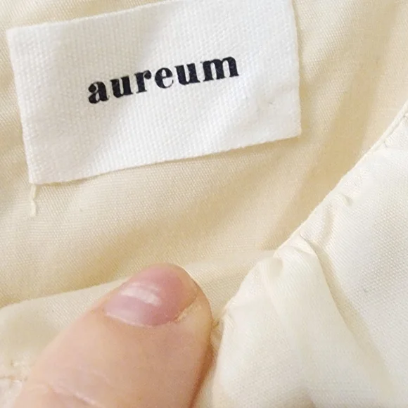 Aureum Elegant Cream Dress with Black Accents - Picture 5 of 11